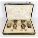 A cased silver cruet set with Hunkin & Heath musta