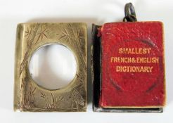 Smallest French & English dictionary with magnifier on white metal case 32mm x 26mm hinge a/f