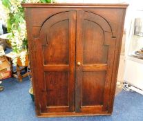 A large 18thC. oak wall cupboard