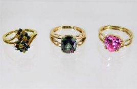 Three 9ct gold rings with mixed stones 11.4g