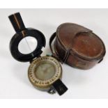 A WW2 brass military compass with case dated 1943