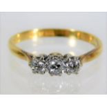 An 18ct gold trilogy ring set with 0.25ct diamond
