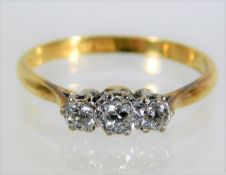 An 18ct gold trilogy ring set with 0.25ct diamond