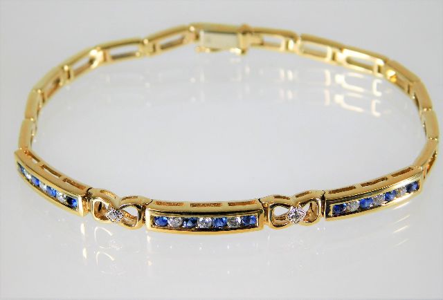 A 9ct gold diamond & sapphire bracelet 10.3g