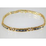 A 9ct gold diamond & sapphire bracelet 10.3g
