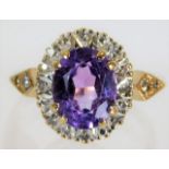 A 9ct gold ring set with amethyst & 0.16ct of diam