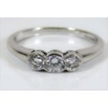 An 18ct white gold trilogy ring set with approx. 0