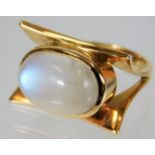 A yellow metal, tests as 18ct gold, moonstone ring 9.1g size N