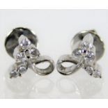 A pair of 18ct white gold earrings set with five d
