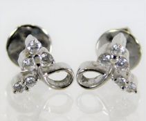 A pair of 18ct white gold earrings set with five d