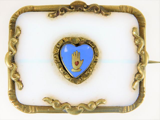 A Victorian brooch with enamelled Shaker heart in