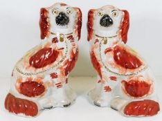 A pair of Victorian Staffordshire spaniel dogs 10i