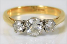 An 18ct gold diamond trilogy ring with approx. 1.1