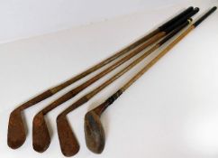 A James Watt putter, an Anderson Mashie club & two