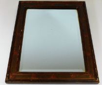 An early 20thC. wooden framed mirror 18.5in x 14.7