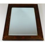 An early 20thC. wooden framed mirror 18.5in x 14.7