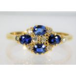 An 18ct gold diamond & sapphire ring 3.6g size T