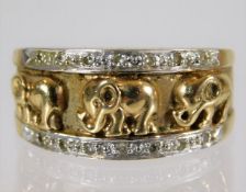 A 9ct gold ring with elephant decor set with diamo