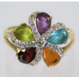 A 9ct gold ring set with diamonds & mixed stones 3