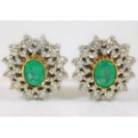 A pair of 18ct diamond & emerald earrings approx.