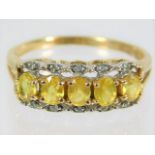 A 9ct gold ring set with lemon coloured citrine &