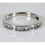 An 18ct white gold half eternity ring set with 0.2