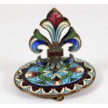 A Victorian enamelled gilt menu holder