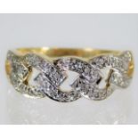 A 9ct gold yellow metal ring with diamonds 2.6g