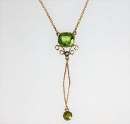 A 9ct gold pendant necklace set with peridot & pea