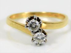 An 18ct gold crossover ring with approx. 0.5ct dia