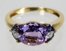 A 9ct gold ring set with diamond & amethyst 2.8g s