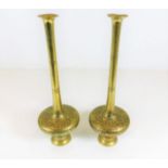 A pair of tall brass Islamic vases