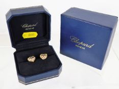 A pair of Chopard 18ct gold Happy Diamonds heart s