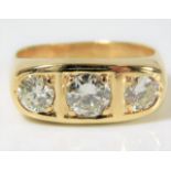 An 18ct gold trilogy ring set with diamonds of app
