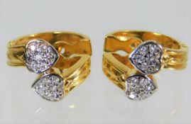 A pair of 14ct gold diamond earrings 6.4g
