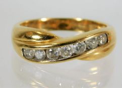 An 18ct gold ring set with seven diamonds of 0.5ct