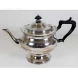 A Mappin & Webb footed teapot with hammered effect