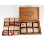 An early 20thC. boxed quantity of vintage collecto