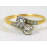 An 18ct gold diamond crossover ring of approx. 0.7