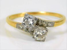 An 18ct gold diamond crossover ring of approx. 0.7