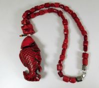 A "red coral" fish necklace