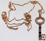 An 18ct pink gold chain & key pendant set with dia