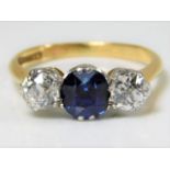 A diamond & unheated natural sapphire trilogy ring set with approx. 1ct of white old cut diamonds 3.