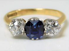 A diamond & unheated natural sapphire trilogy ring set with approx. 1ct of white old cut diamonds 3.