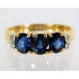 An 18ct gold sapphire & diamond ring 4.5g size R