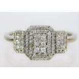 A 9ct white gold art deco style ring set with diam