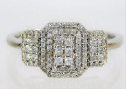 A 9ct white gold art deco style ring set with diam