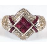 An 18ct white gold ring with valuation certificate set with ruby & 1.8ct diamond 8.1g size O/P