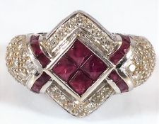 An 18ct white gold ring with valuation certificate set with ruby & 1.8ct diamond 8.1g size O/P