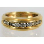 An 18ct half eternity ring set with 0.5ct diamond